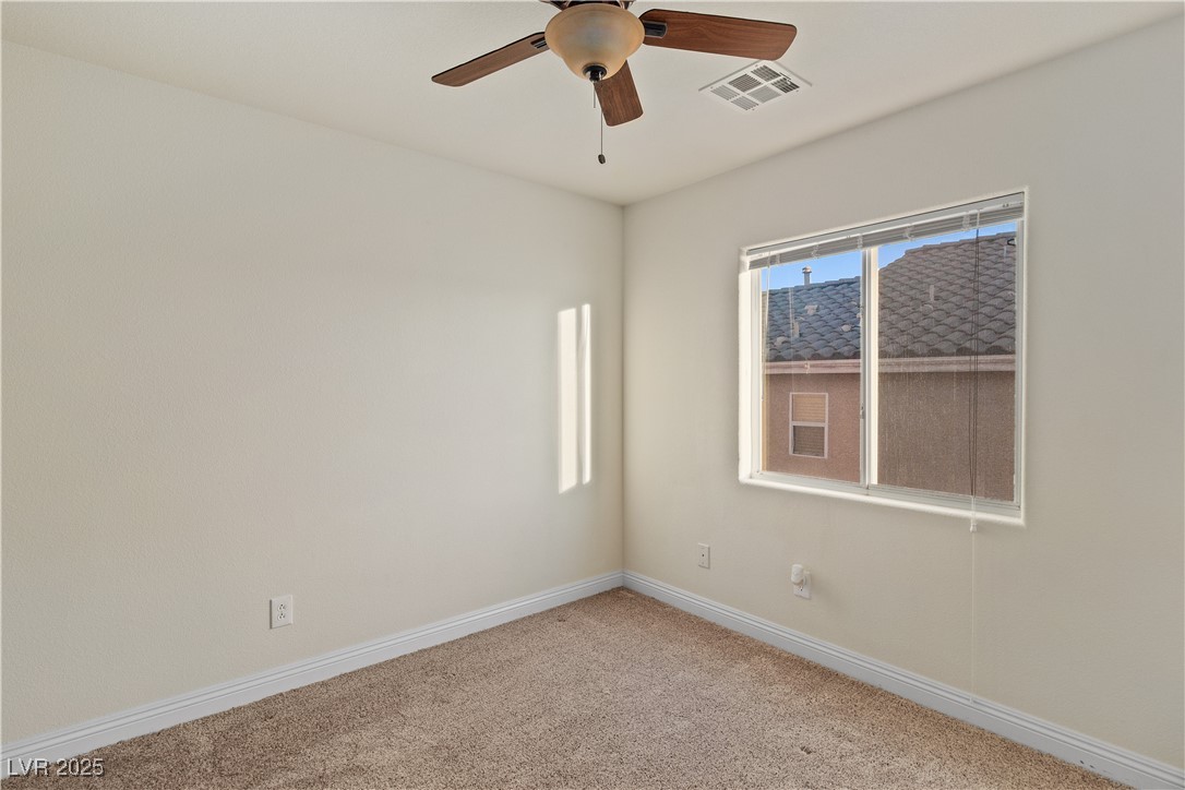 2715 Brinkley Manor Street Laughlin, NV 89029 - Photo 39 of 89 Carpeted Third Bedroom with baseboards and a ceiling fan