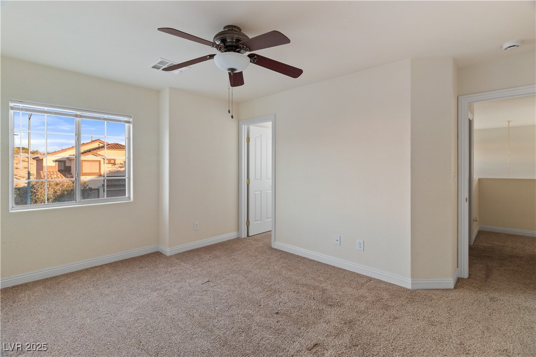 2715 Brinkley Manor Street Laughlin, NV 89029 - Photo 43 of 89 Fourth Bedroom with light carpet and a ceiling fan