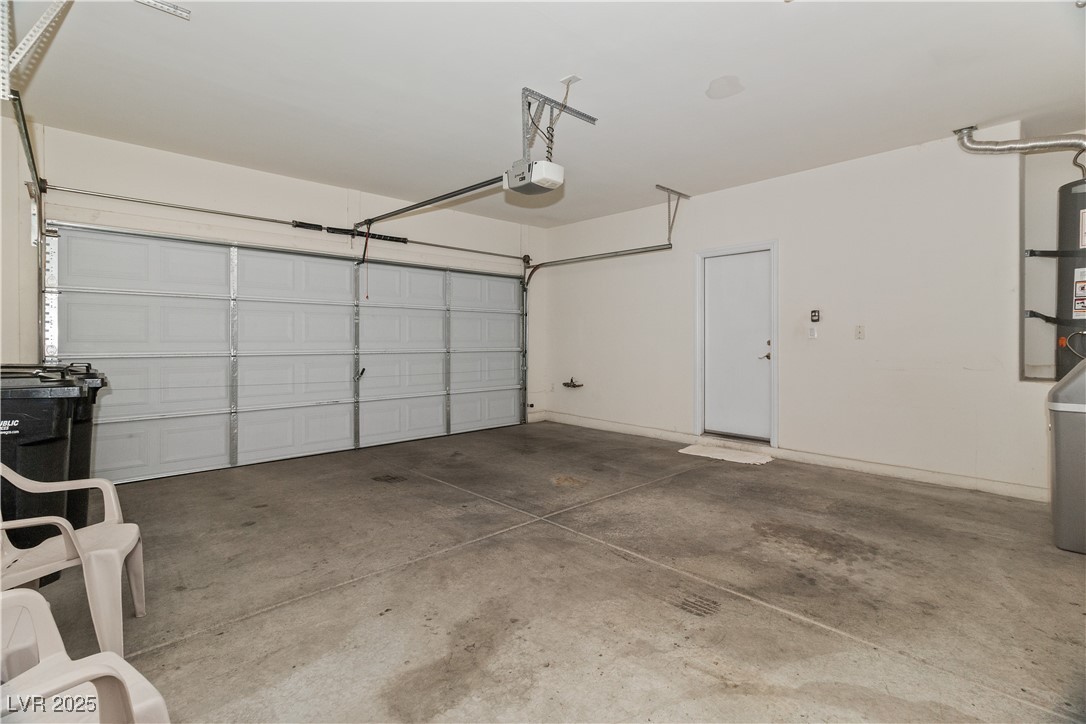 2715 Brinkley Manor Street Laughlin, NV 89029 - Photo 47 of 89 Garage featuring secured water heater and a garage door opener