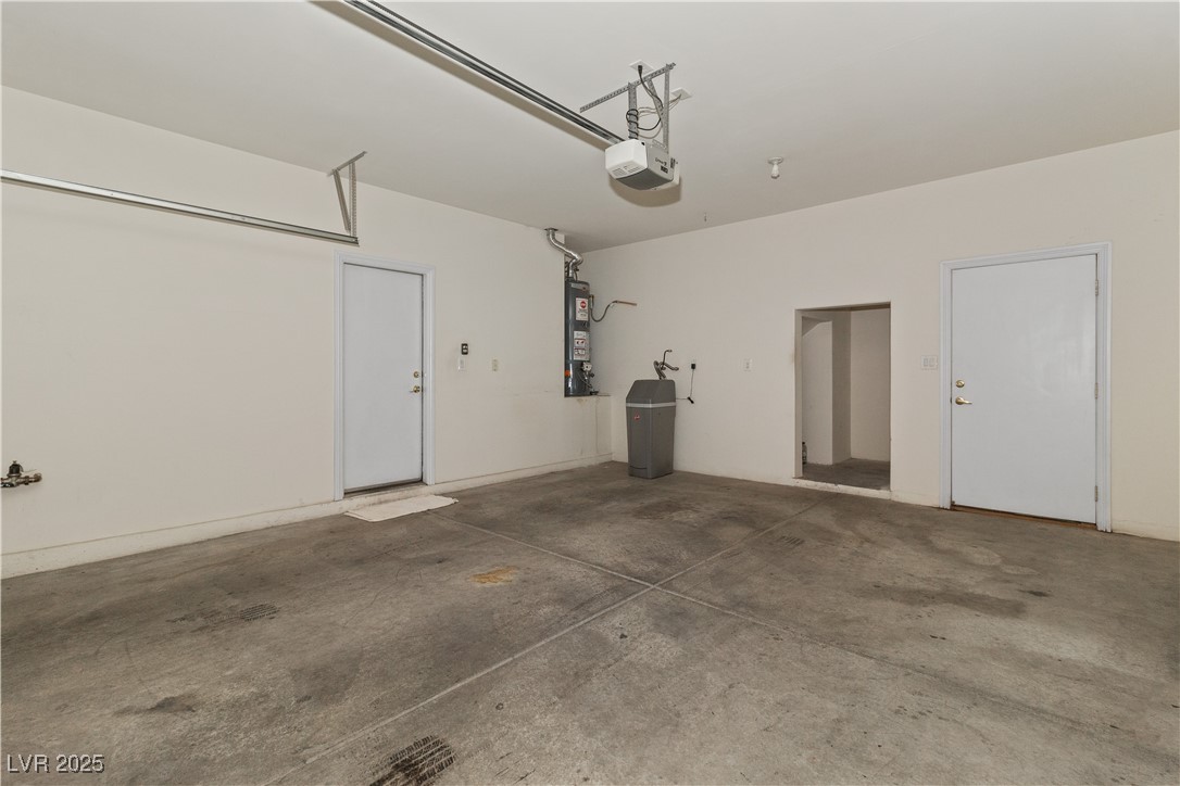 2715 Brinkley Manor Street Laughlin, NV 89029 - Photo 48 of 89 Garage featuring gas water heater and a garage door opener