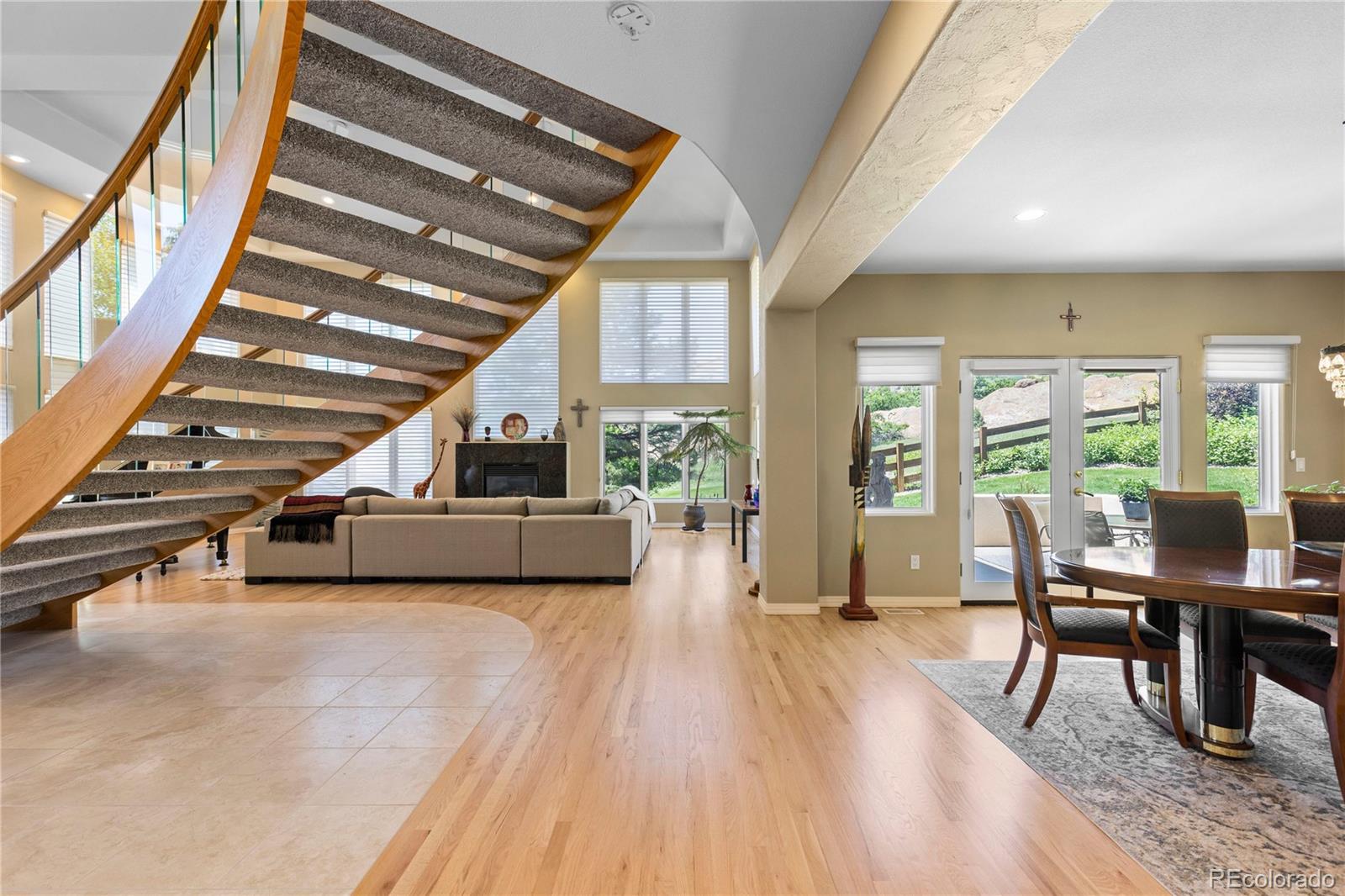 69 North Ranch Road Littleton, CO 80127 - Photo 11 of 50 a view of a livingroom with furniture and a floor to ceiling window