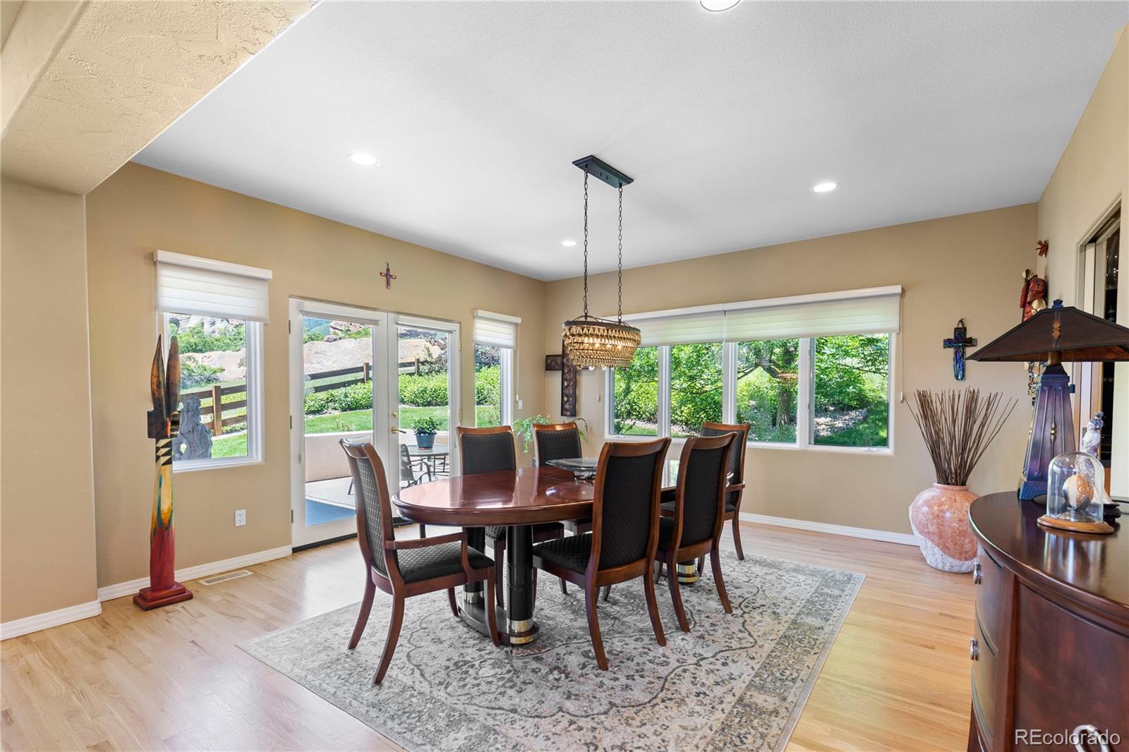 69 North Ranch Road Littleton, CO 80127 - Photo 13 of 50 a view of a dining room with furniture window and outside view