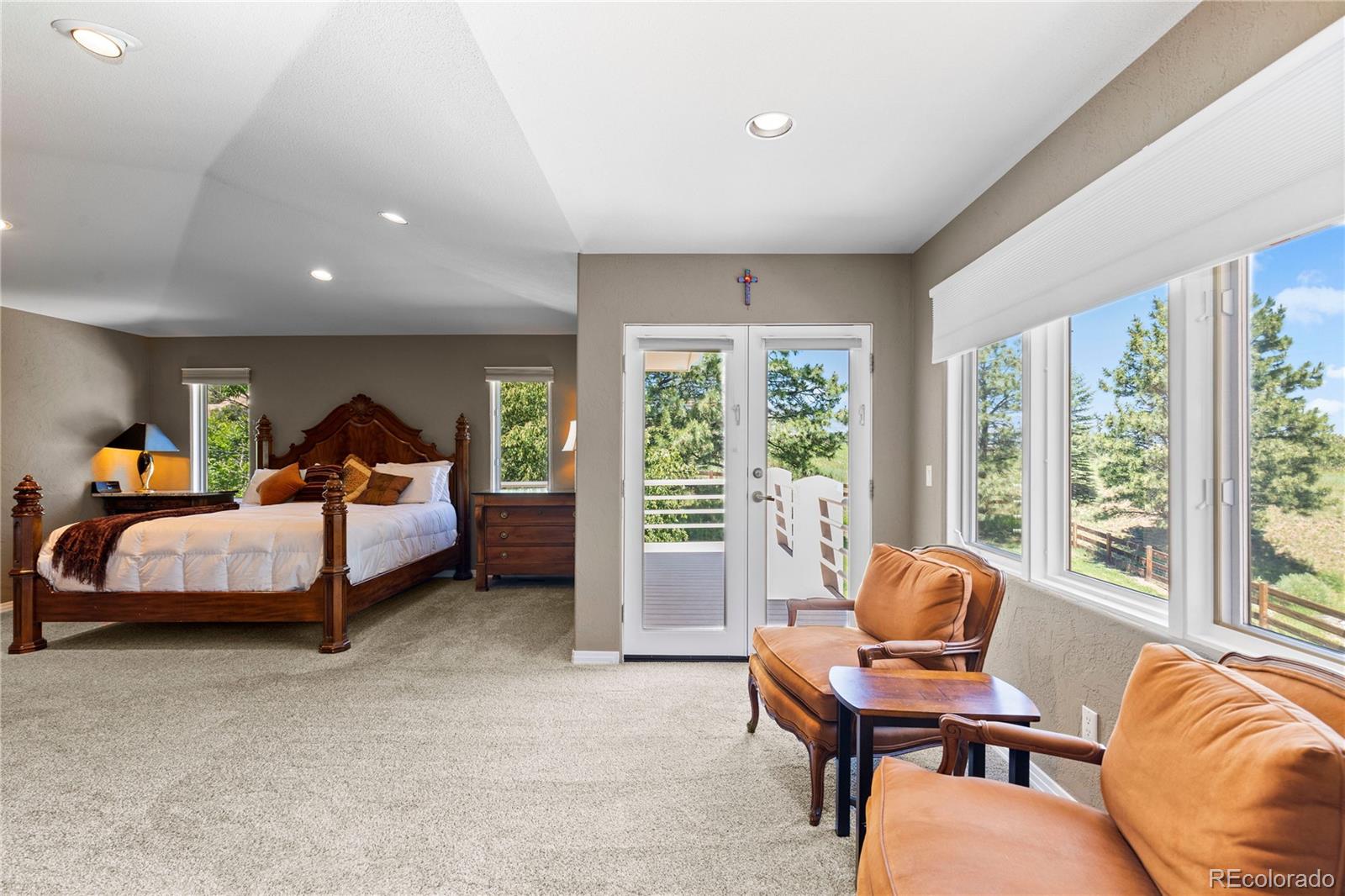 69 North Ranch Road Littleton, CO 80127 - Photo 22 of 50 a bedroom with a bed and a large window