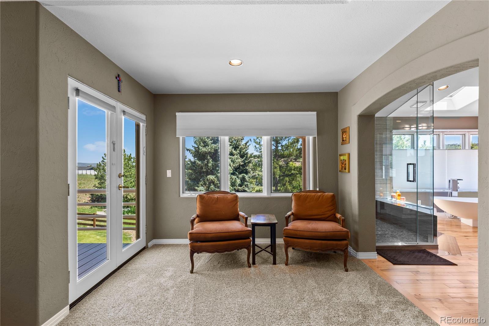 69 North Ranch Road Littleton, CO 80127 - Photo 24 of 50 a living room with furniture and a floor to ceiling window