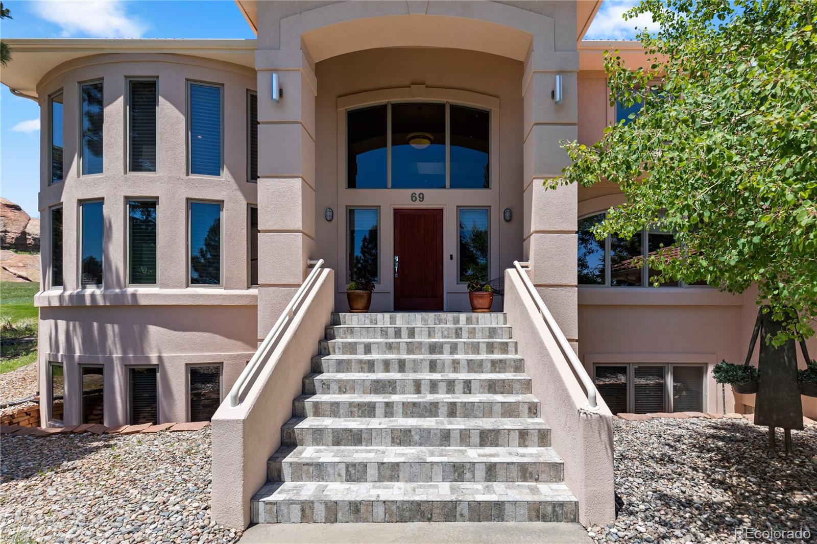 69 North Ranch Road Littleton, CO 80127 - Photo 3 of 50 front view of a building
