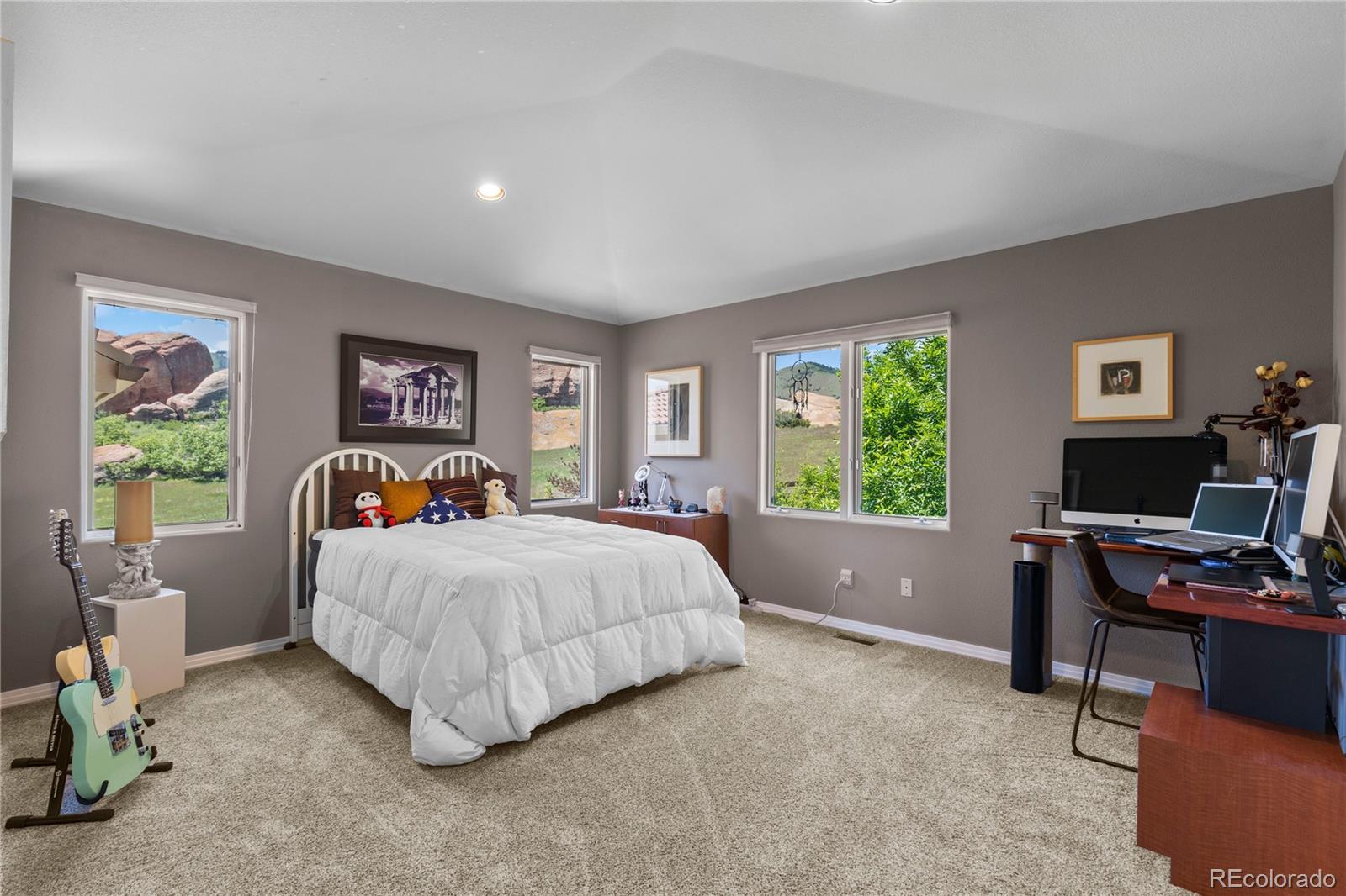 69 North Ranch Road Littleton, CO 80127 - Photo 31 of 50 a bed room with a bed and a window