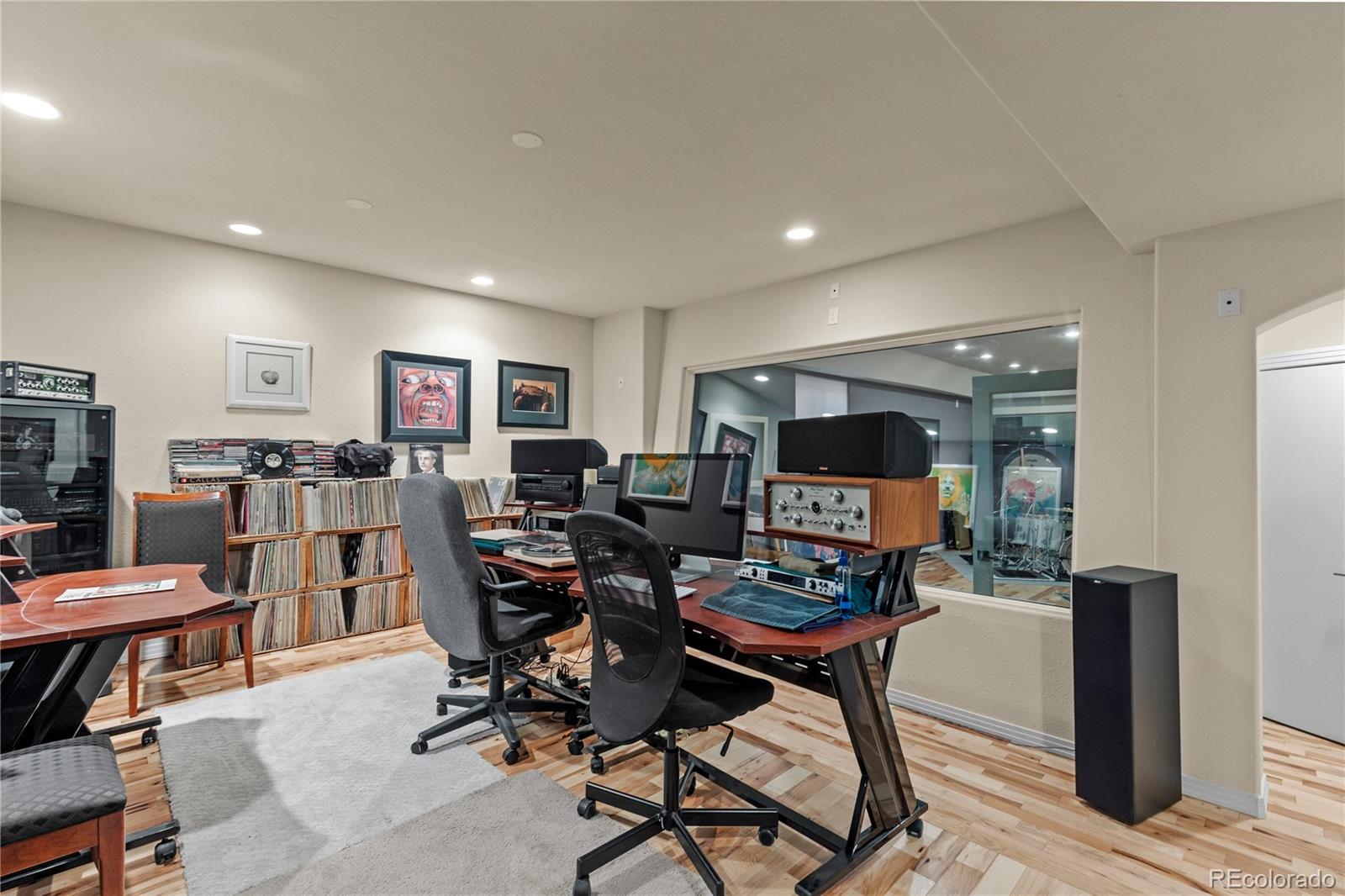 69 North Ranch Road Littleton, CO 80127 - Photo 37 of 50 a living room with furniture and a flat screen tv