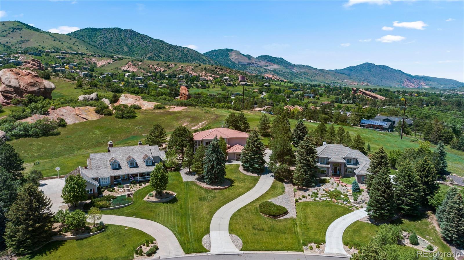 69 North Ranch Road Littleton, CO 80127 - Photo 4 of 50 an aerial view of a house with yard swimming pool and mountain view