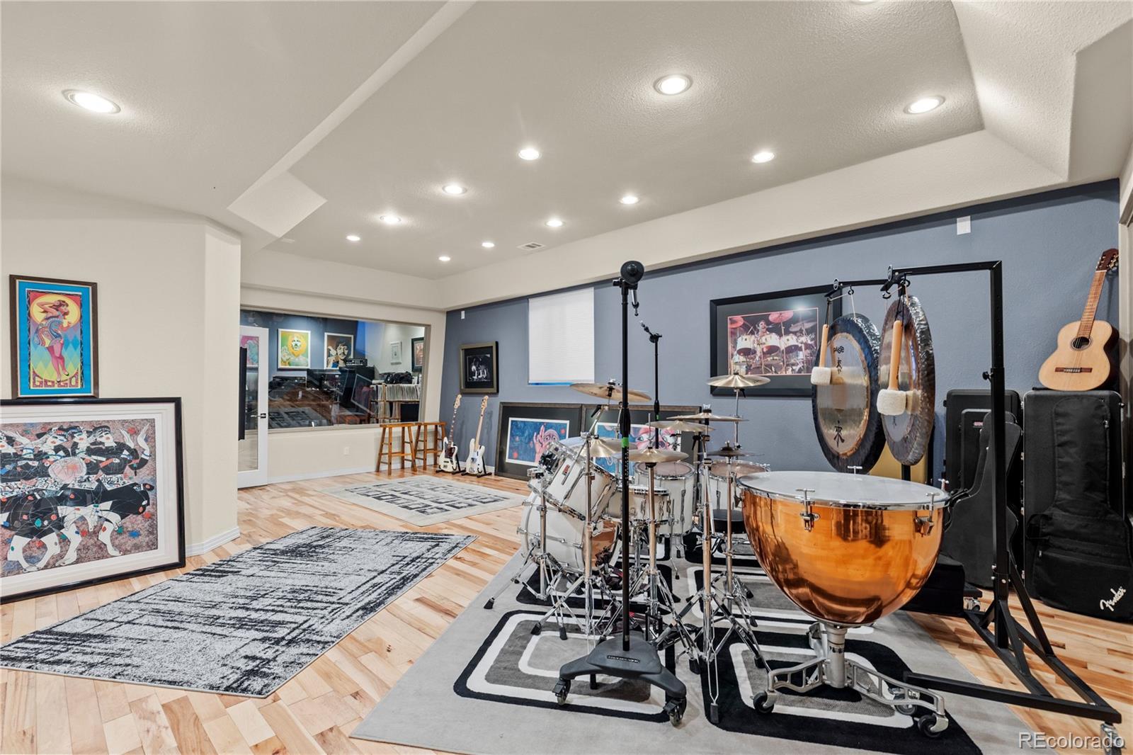 69 North Ranch Road Littleton, CO 80127 - Photo 41 of 50 a room with furniture and wooden floor