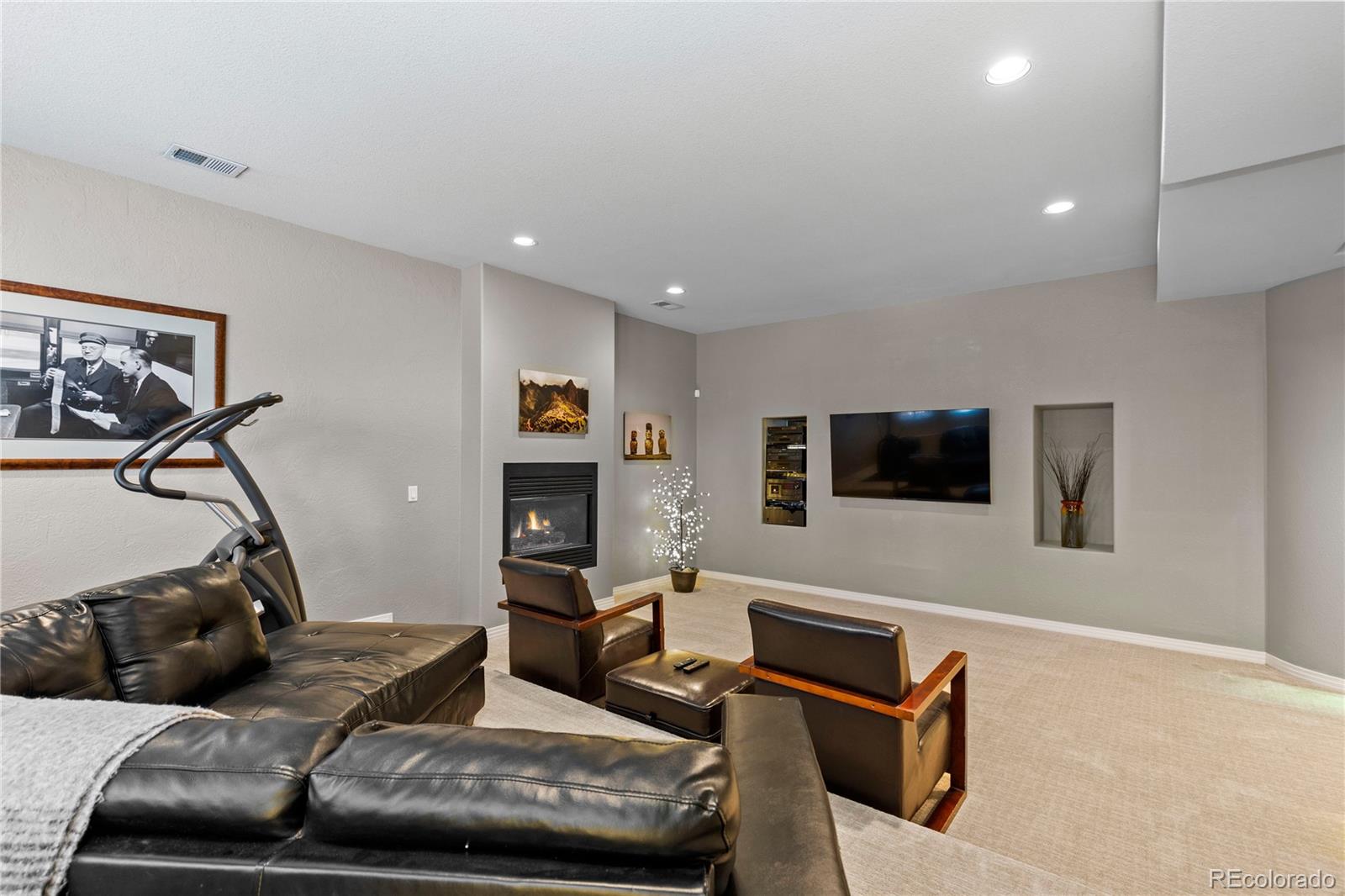 69 North Ranch Road Littleton, CO 80127 - Photo 43 of 50 a living room with furniture and a flat screen tv
