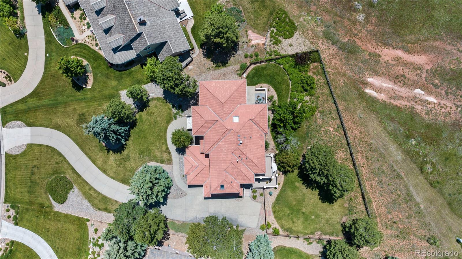 69 North Ranch Road Littleton, CO 80127 - Photo 50 of 50 an aerial view of a house with outdoor space