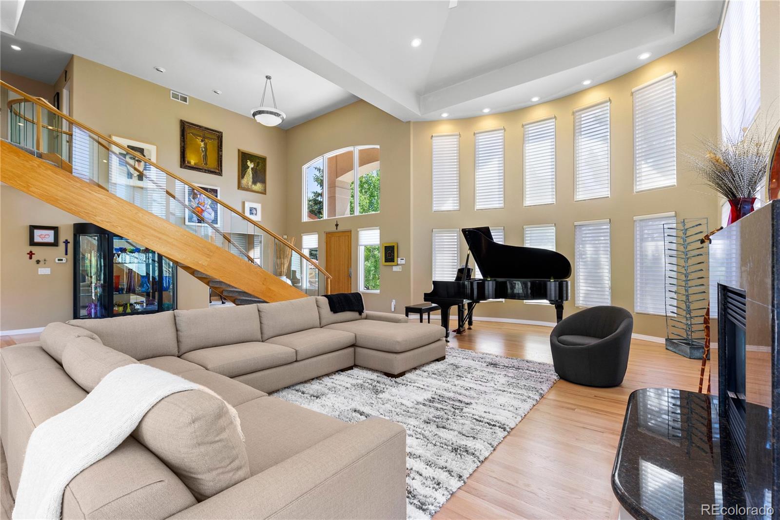 69 North Ranch Road Littleton, CO 80127 - Photo 7 of 50 a living room with furniture fireplace and a large window
