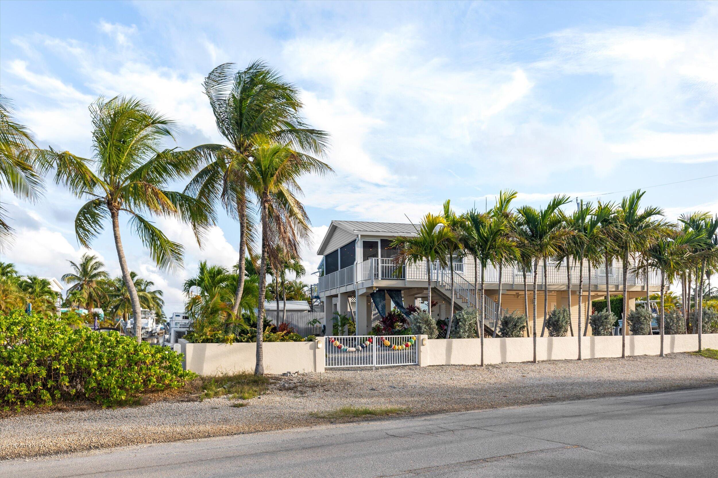 157 Mars Lane Key West, FL 33040 - Photo 40 of 41 a view of a palm tree with building