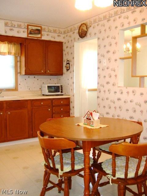 13634 Carpenter Road Garfield Heights, OH 44125 - Photo 10 of 24 The large "eat-in" area of the kitchen can accomodate today's larger dining sets.