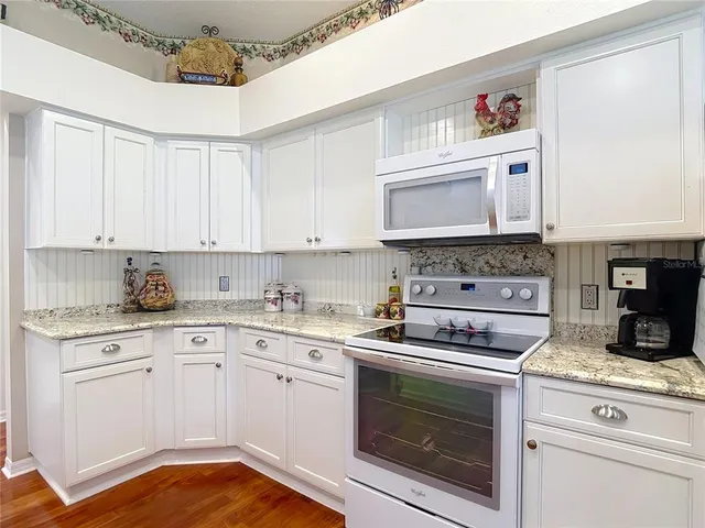 a bedroom with a bed and a television