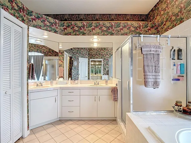 a view of a house with yard and tree s