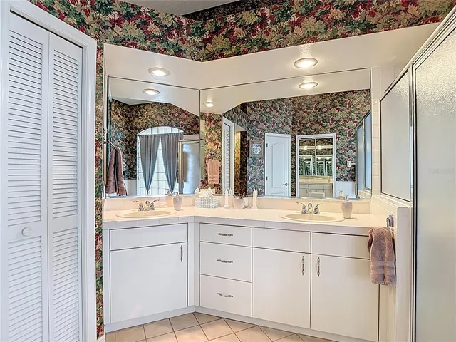 a view of a house with yard and sitting area