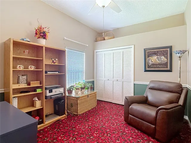 a front view of a house with a garden and yard