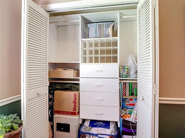 a front view of a house with yard and green space