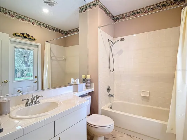 a bedroom with a bed and flat screen tv