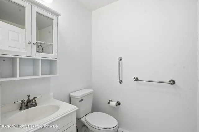 a bathroom with a shower and toilet