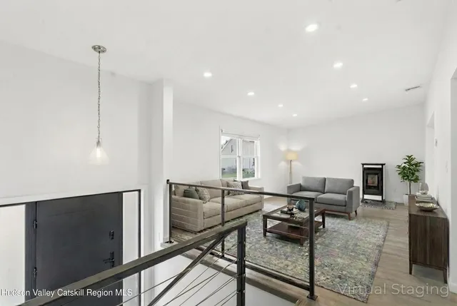 a view of a living room and workspace