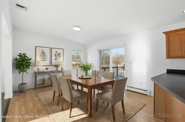 an empty room with wooden floor and a window