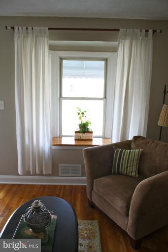 749 Arncliffe Road Baltimore, MD 21221 - Photo 2 of 20 a living room with a couch and a window