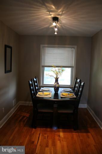 749 Arncliffe Road Baltimore, MD 21221 - Photo 13 of 20 a view of a dining room with furniture window and wooden floor