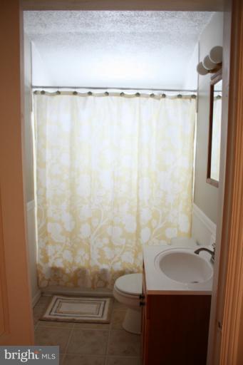 749 Arncliffe Road Baltimore, MD 21221 - Photo 7 of 20 a bathroom with a sink toilet and shower