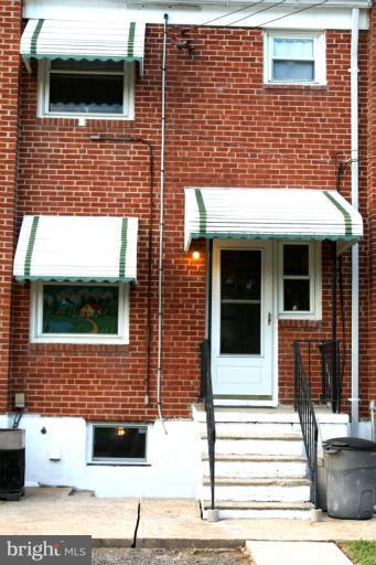 749 Arncliffe Road Baltimore, MD 21221 - Photo 9 of 20 a view of a brick house with a street