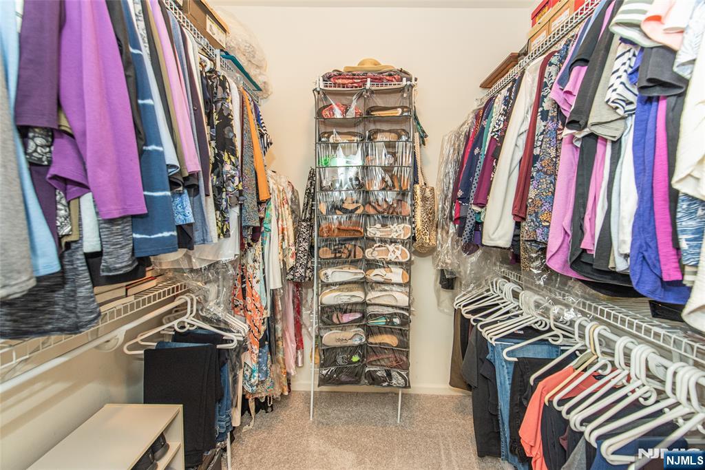 6105 Harcourt Road Clifton, NJ 07013 - Photo 16 of 23 a view of walk in closet with clothes
