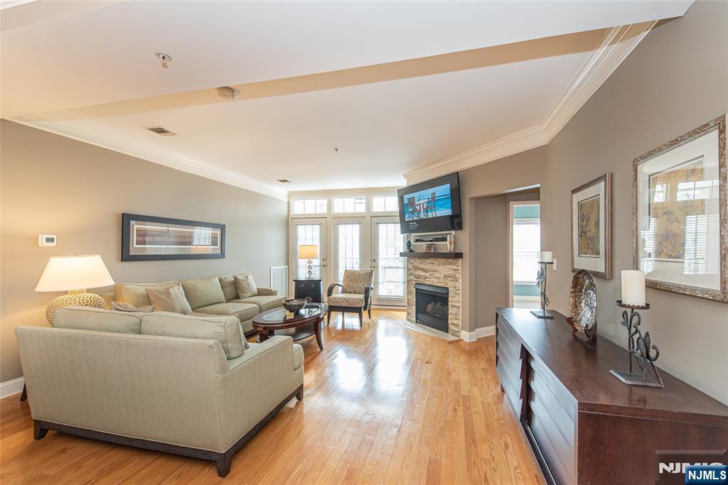 6105 Harcourt Road Clifton, NJ 07013 - Photo 5 of 23 a living room with furniture and a wooden floor