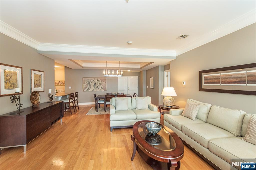 6105 Harcourt Road Clifton, NJ 07013 - Photo 7 of 23 a living room with furniture and a wooden floor
