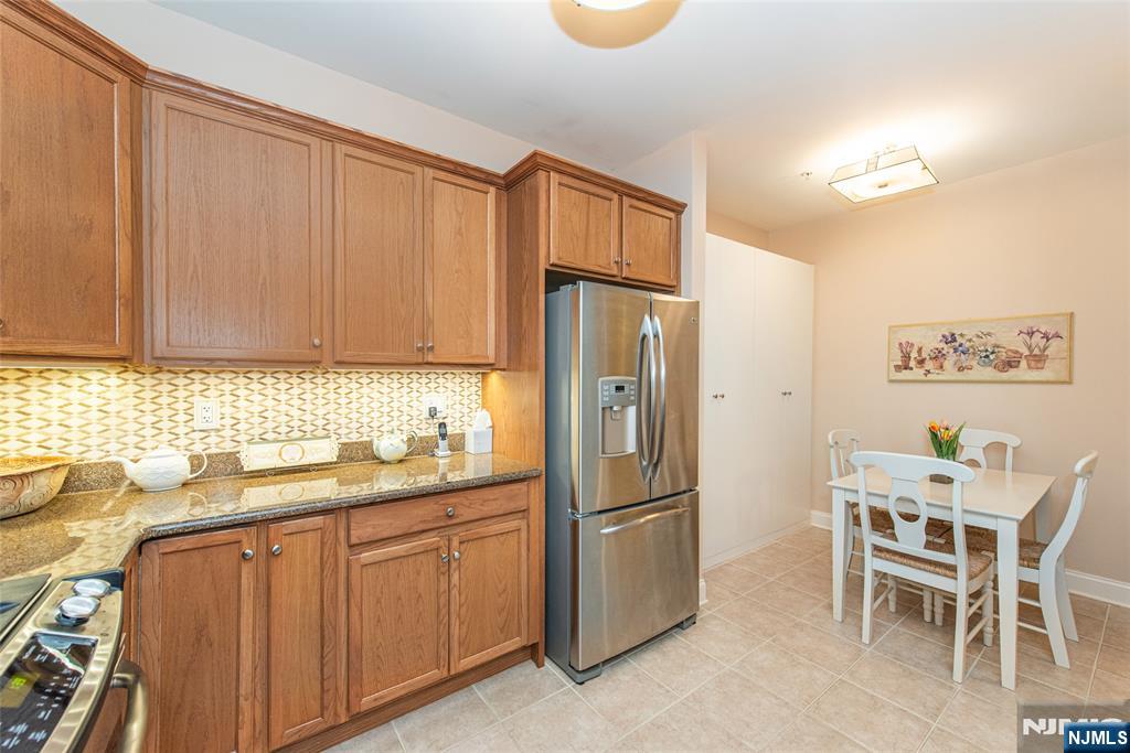 6105 Harcourt Road Clifton, NJ 07013 - Photo 9 of 23 a kitchen with stainless steel appliances a refrigerator and sink