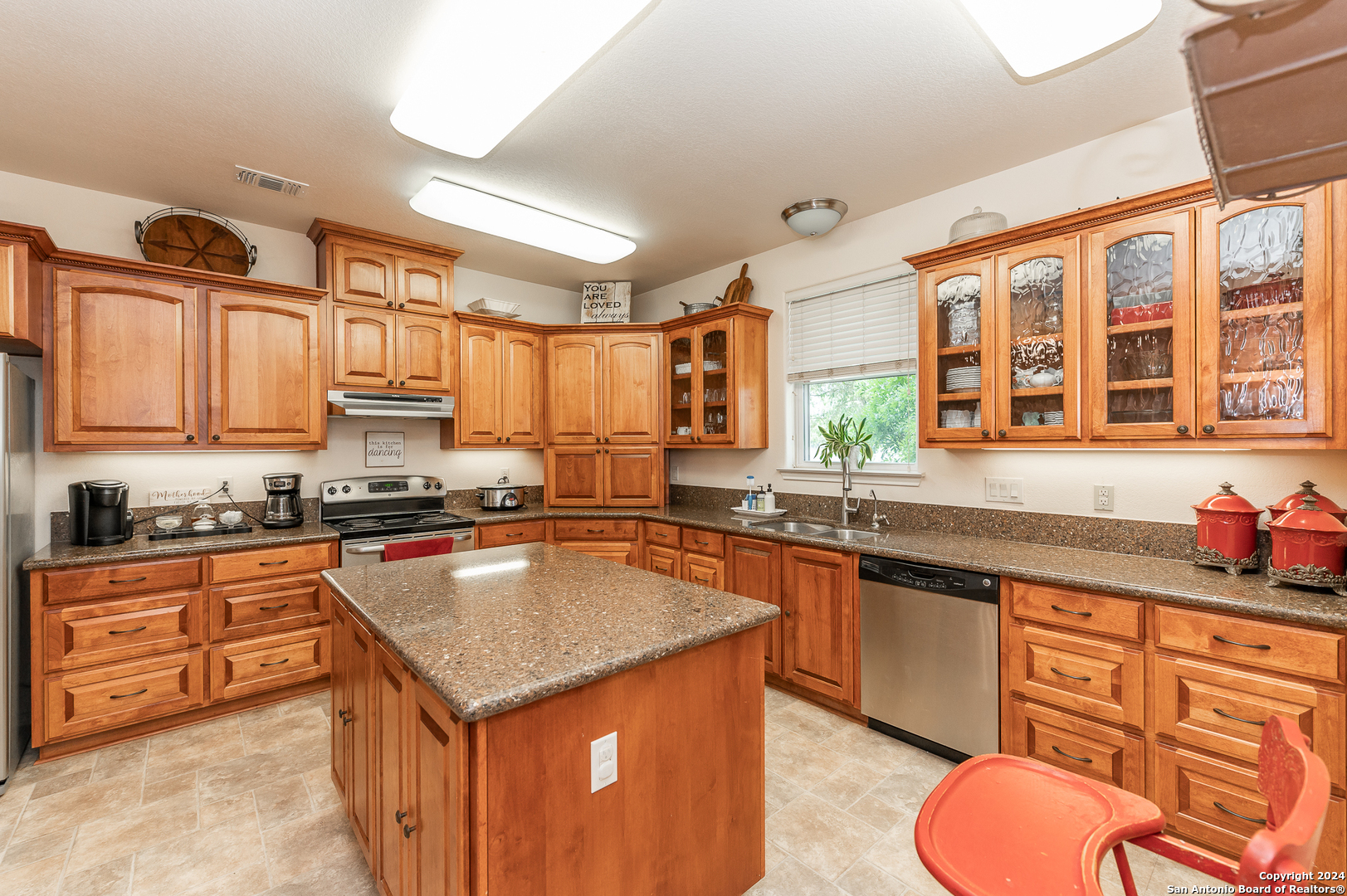511 County Road 423 D'Hanis, TX 78850 - Photo 13 of 47 a kitchen with stainless steel appliances granite countertop a sink stove and cabinets