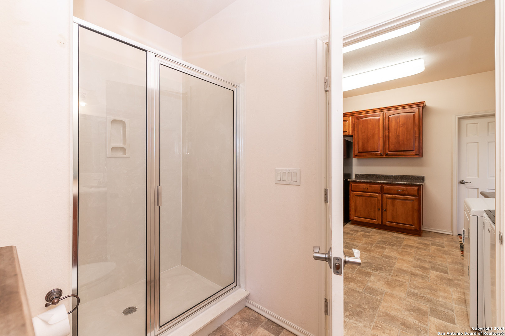 511 County Road 423 D'Hanis, TX 78850 - Photo 19 of 47 a bathroom with a shower and a glass door