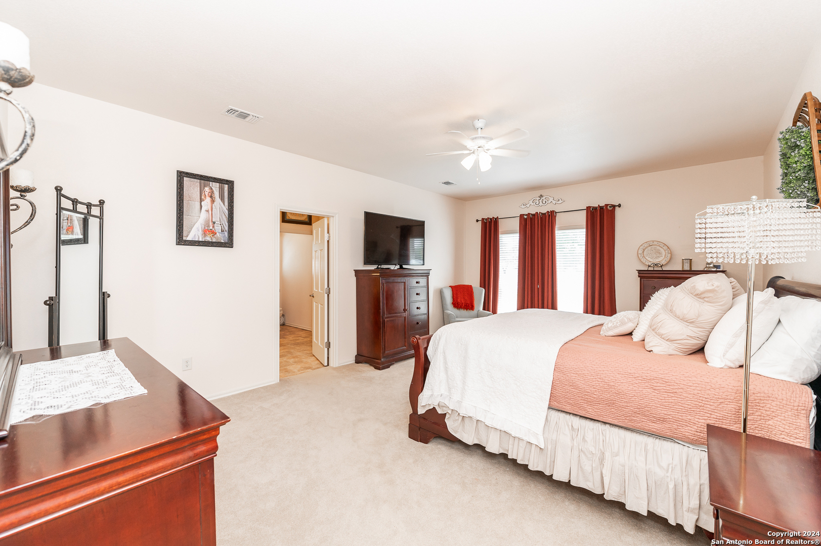 511 County Road 423 D'Hanis, TX 78850 - Photo 20 of 47 a bedroom with a large bed and a tv