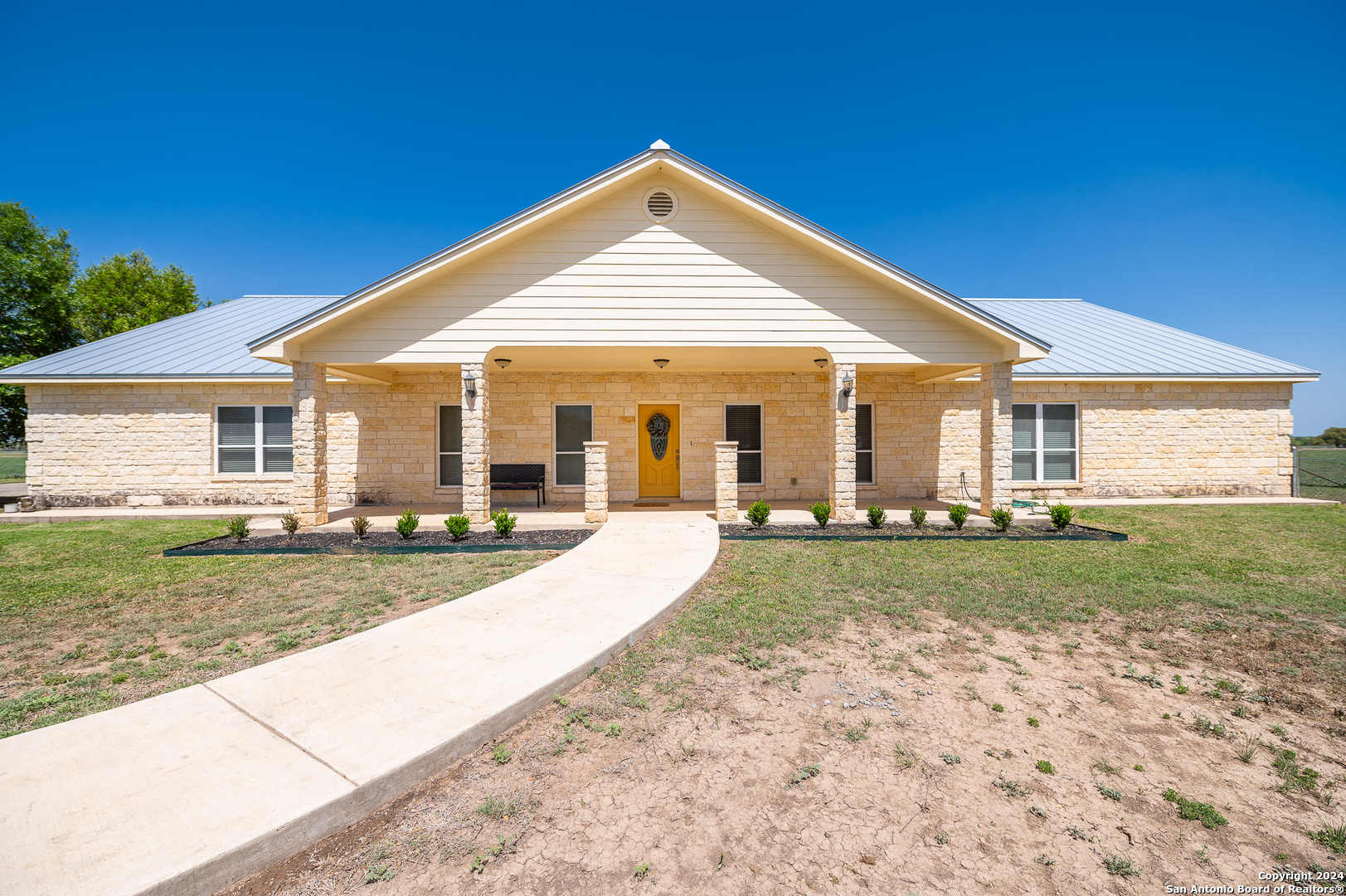 511 County Road 423 D'Hanis, TX 78850 - Photo 2 of 47 a view of a house with a yard and sitting area