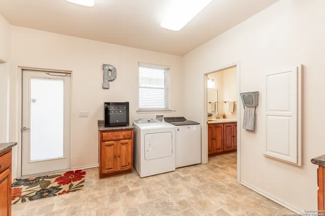 a kitchen with stainless steel appliances granite countertop a refrigerator and a stove