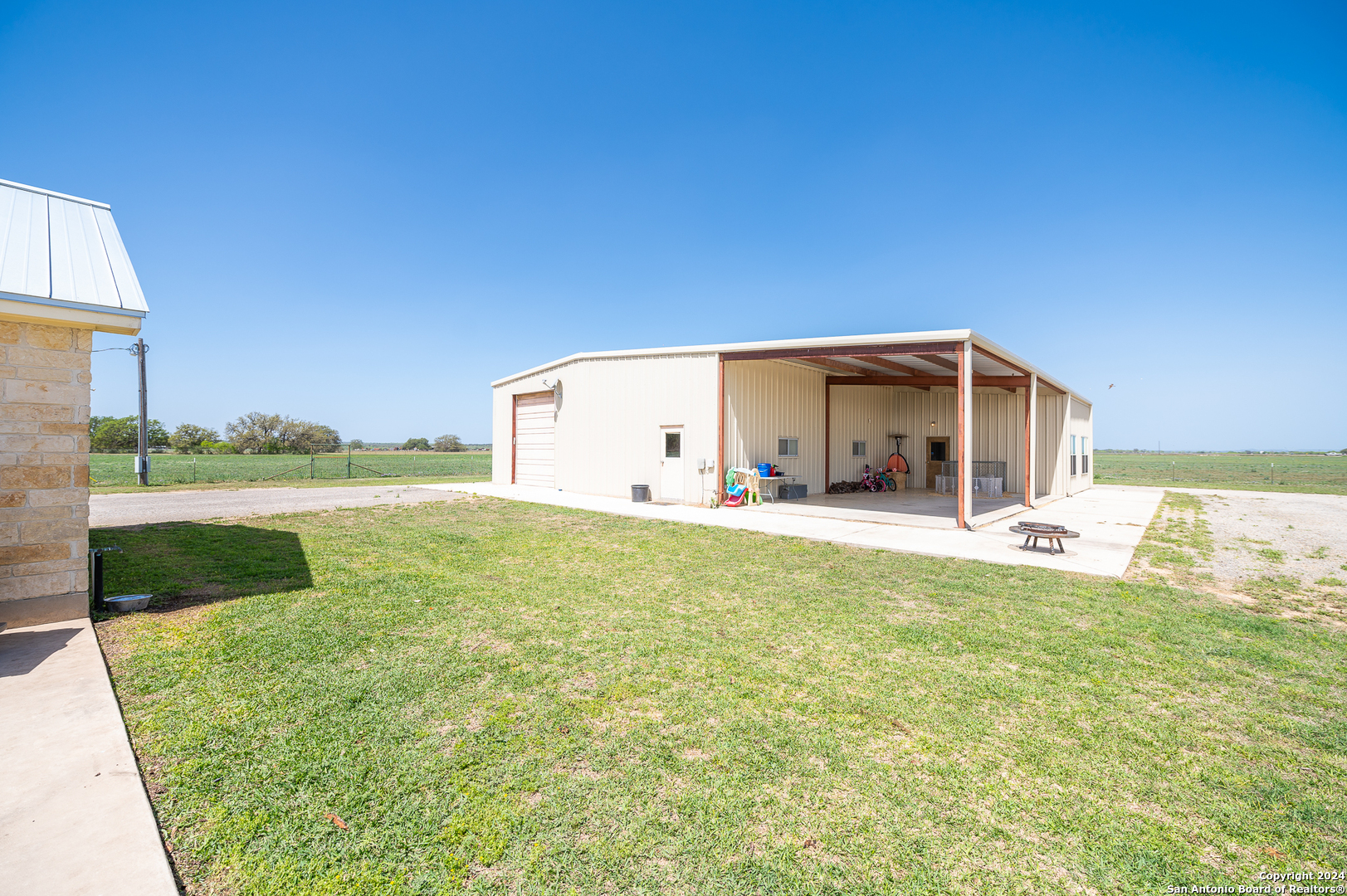 511 County Road 423 D'Hanis, TX 78850 - Photo 34 of 47 a backyard of a house with lots of green space and plants