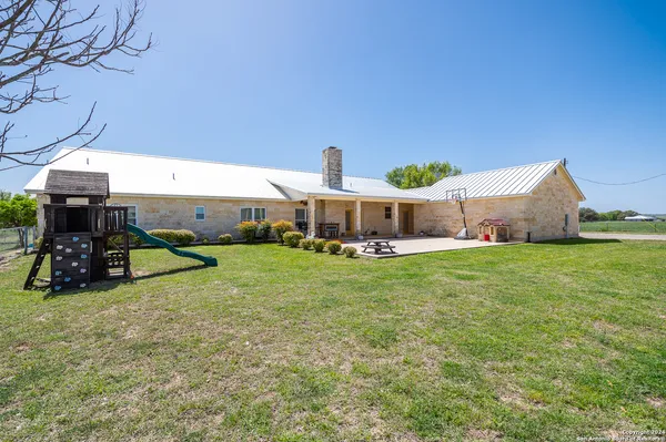 a view of a house with a back yard