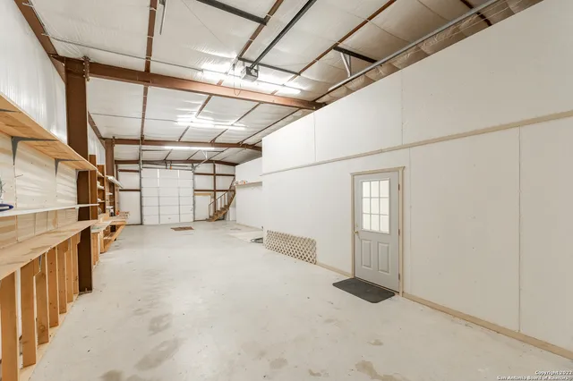 a view of empty room with wooden walls