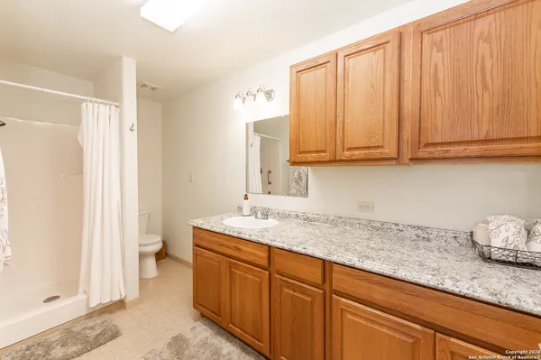 a kitchen with stainless steel appliances granite countertop a sink and cabinets