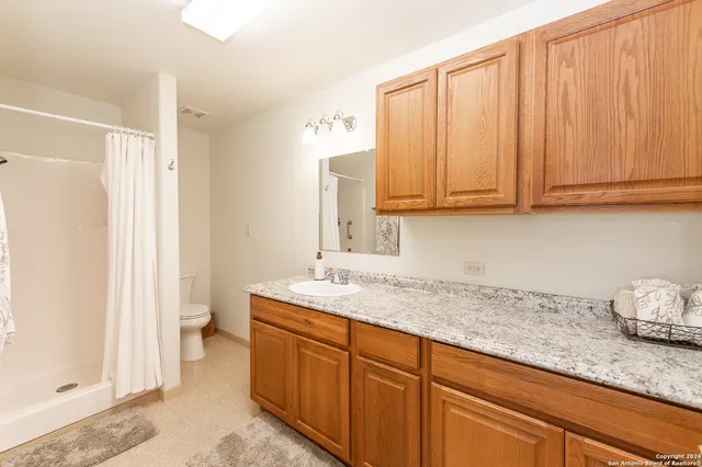 a kitchen with stainless steel appliances granite countertop a sink and cabinets
