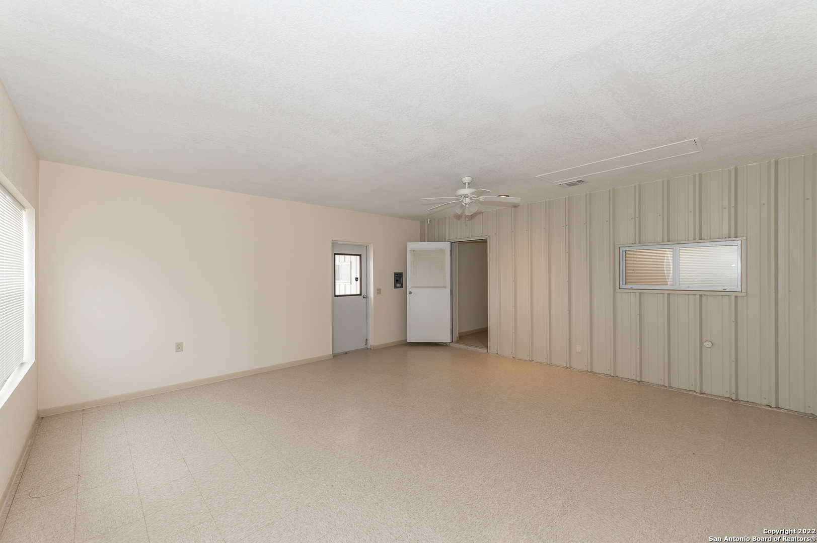511 County Road 423 D'Hanis, TX 78850 - Photo 44 of 47 an empty room with windows and ceiling fan view