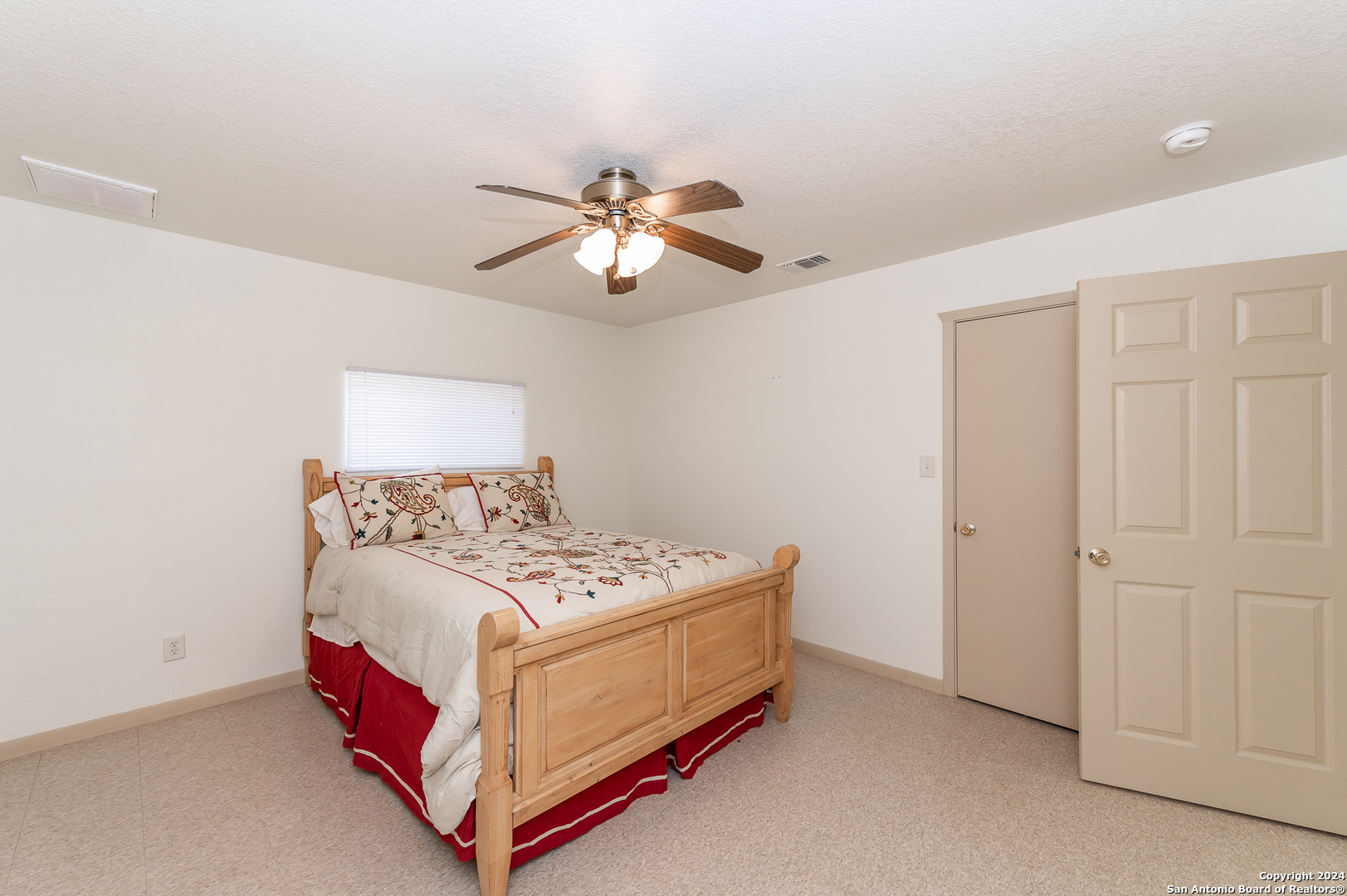 511 County Road 423 D'Hanis, TX 78850 - Photo 45 of 47 a bedroom with a bed and a chandelier