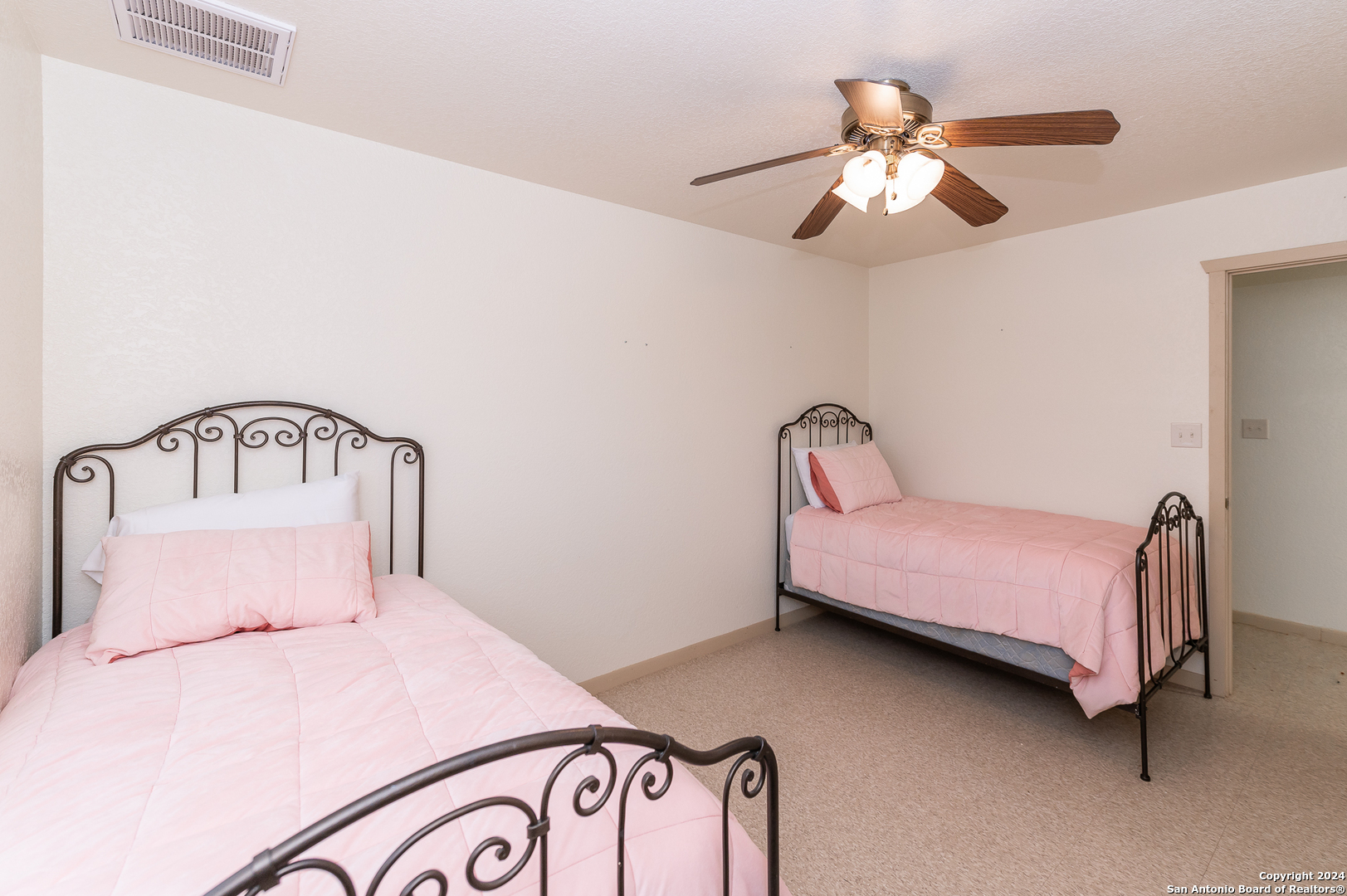 511 County Road 423 D'Hanis, TX 78850 - Photo 47 of 47 a bedroom with a bed and a chandelier