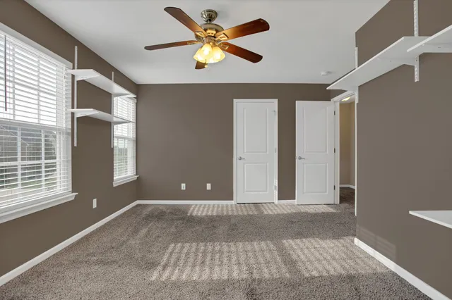 a view of livingroom with hardwood floor and ceiling fan