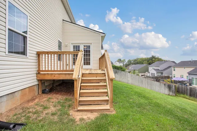 a view of a house with a yard and sitting area